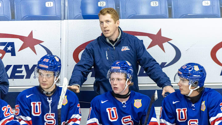 Aug 2, 2024; Plymouth, MI, USA; USA’s head coach Dave Carle during the second period of the 2024 World Junior Summer Showcase at USA Hockey Arena. Mandatory Credit: David Reginek-Imagn Images