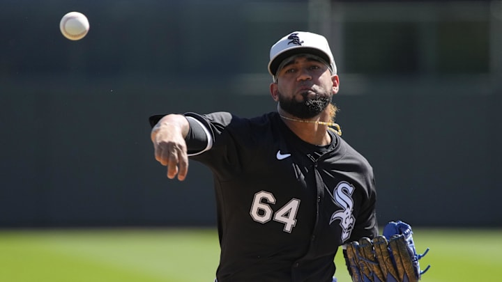 Chicago White Sox relief pitcher Deivi Garcia (64) throws against the San Diego Padres in the first inning at Camelback Ranch-Glendale in 2024. Chicago White Sox relief pitcher Deivi Garcia (64) throws against the San Diego Padres in the first inning at Camelback Ranch-Glendale in 2024.