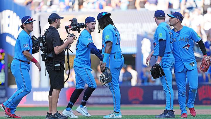 Aug 15, 2026; Toronto, Ontario, CAN; Toronto Blue Jays first baseman Charles McAdoo (26) celebrates the win with pinch hitter & second baseman Ernie Clement (22) against the New York Yankees at the end of the ninth inning at Rogers Centre. Mandatory Credit: Nick Turchiaro-Imagn Images Aug 15, 2026; Toronto, Ontario, CAN; Toronto Blue Jays first baseman Charles McAdoo (26) celebrates the win with pinch hitter & second baseman Ernie Clement (22) against the New York Yankees at the end of the ninth inning at Rogers Centre. Mandatory Credit: Nick Turchiaro-Imagn Images