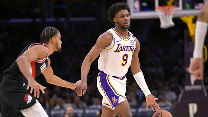 Dec 8, 2024; Los Angeles, California, USA;  Los Angeles Lakers guard Bronny James (9) handles the ball in the second half against the Portland Trail Blazers at Crypto.com Arena. Mandatory Credit: Jayne Kamin-Oncea-Imagn Images