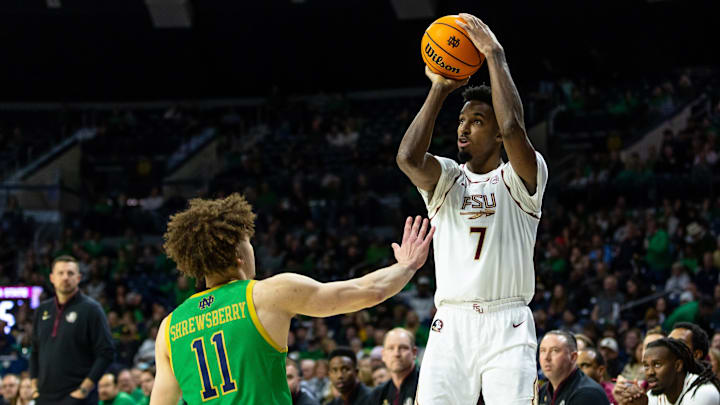 Feb 7, 2026; South Bend, Indiana, USA; Florida State Seminoles forward Chauncey Wiggins (7) shoots as Notre Dame Fighting Irish guard Braeden Shrewsberry (11) defends during the second half at Purcell Pavilion at the Joyce Center. Mandatory Credit: Michael Caterina-Imagn Images