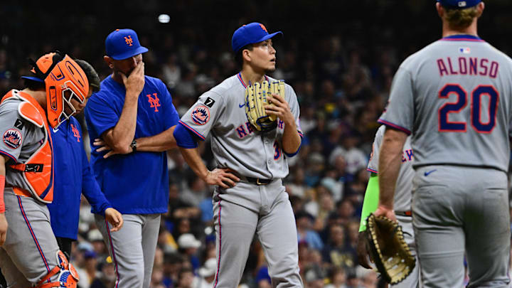 Aug 8, 2025; Milwaukee, Wisconsin, USA; New York Mets starting pitcher Kodai Senga (34) looks on during a mound visit in the fifth inning against the Milwaukee Brewers at American Family Field. Mandatory Credit: Benny Sieu-Imagn Images