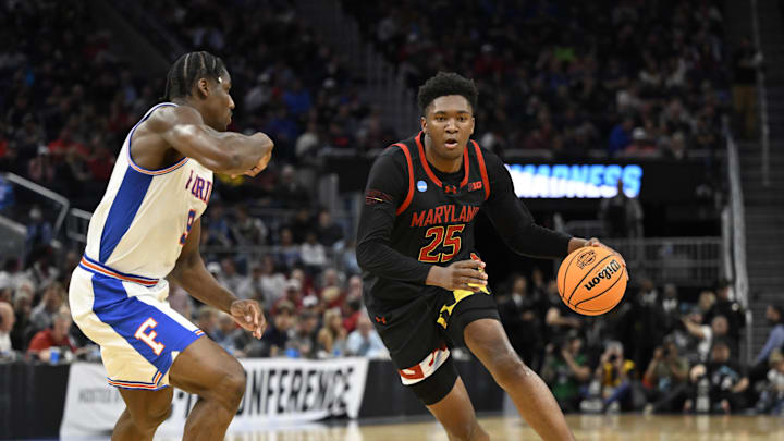 Mar 27, 2025; San Francisco, CA, USA; Maryland Terrapins center Derik Queen (25) dribbles down court past Florida Gators center Rueben Chinyelu (9) during the second half during a West Regional semifinal of the 2025 NCAA tournament at Chase Center. Mandatory Credit: Eakin Howard-Imagn Images