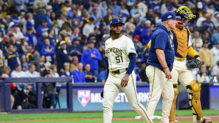 Oct 14, 2025; Milwaukee, Wisconsin, USA; Milwaukee Brewers pitcher Freddy Peralta (51) leaves the mound as he is relieved by manager Pat Murphy (49) in the sixth inning during game two of the NLCS round against the Los Angeles Dodgers for the 2025 MLB playoffs at American Family Field. Mandatory Credit: Benny Sieu-Imagn Images Oct 14, 2025; Milwaukee, Wisconsin, USA; Milwaukee Brewers pitcher Freddy Peralta (51) leaves the mound as he is relieved by manager Pat Murphy (49) in the sixth inning during game two of the NLCS round against the Los Angeles Dodgers for the 2025 MLB playoffs at American Family Field. Mandatory Credit: Benny Sieu-Imagn Images