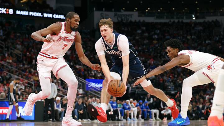 Jan 31, 2026; Houston, Texas, USA; Dallas Mavericks forward Cooper Flagg (32) drives with the ball as Houston Rockets forward Kevin Durant (7) and guard Amen Thompson (1) defend during the third quarter at Toyota Center. Mandatory Credit: Troy Taormina-Imagn Images Jan 31, 2026; Houston, Texas, USA; Dallas Mavericks forward Cooper Flagg (32) drives with the ball as Houston Rockets forward Kevin Durant (7) and guard Amen Thompson (1) defend during the third quarter at Toyota Center. Mandatory Credit: Troy Taormina-Imagn Images