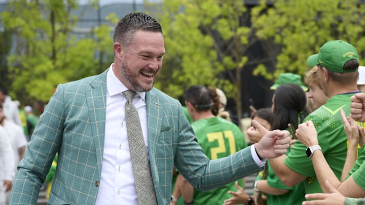 Sep 6, 2025; Eugene, Oregon, USA; Oregon Ducks head coach Dan Lanning greets fans before a game against the Oklahoma State Cowboys at Autzen Stadium. Mandatory Credit: Troy Wayrynen-Imagn Images