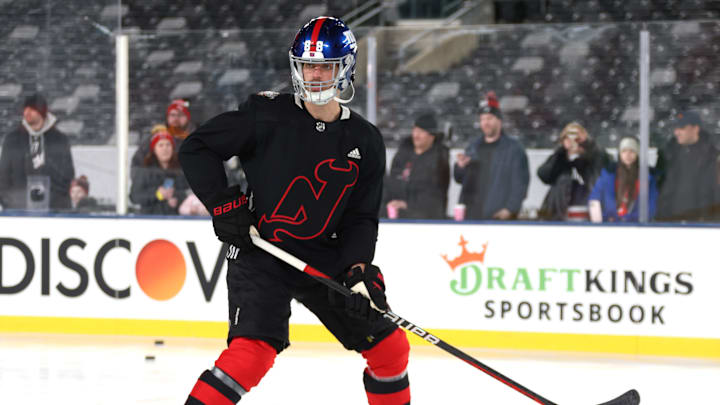 Former Devils defenseman Kevin Bahl sporting a New York Giants helmet during the New Jersey Devils Practice & Family Skate at the 2024 Navy Federal Credit Union Stadium Series