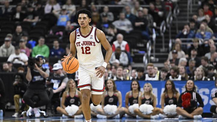 Mar 20, 2025; Providence, RI, USA;  St. John's Red Storm guard RJ Luis Jr. (12) dribbles the ball during the second half against the Omaha Mavericks at Amica Mutual Pavilion. Mandatory Credit: Eric Canha-Imagn Images