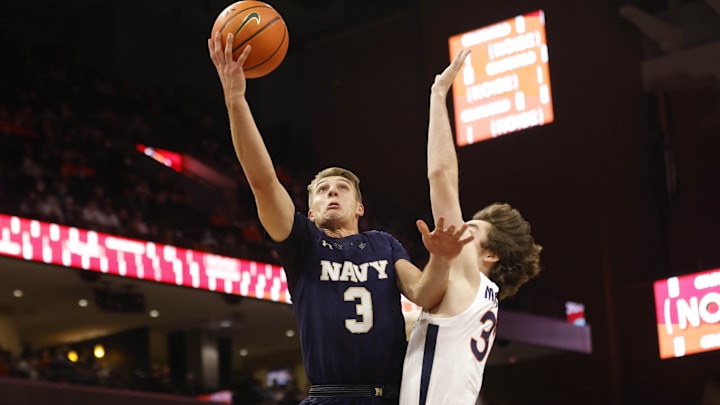 Navy Midshipmen guard Sean Yoder (3) shoots the ball.