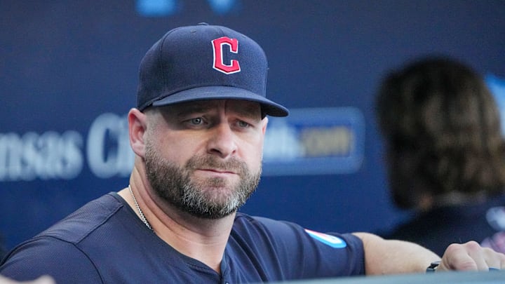 Cleveland Guardians manager Stephen Vogt (12) watches from the dugout against the Kansas City Royals prior to a game at Kauffman Stadium on Sept 4.
