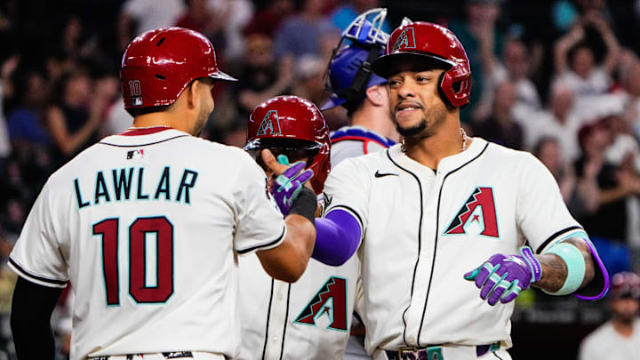 Sep 2, 2025; Phoenix, Arizona, USA; Arizona Diamondbacks second base Ketel Marte (4) celebrates his three run home run with shortstop Jordan Lawlar (10) in the seventh inning against the Texas Rangers at Chase Field. Mandatory Credit: Arianna Grainey-Imagn Images Sep 2, 2025; Phoenix, Arizona, USA; Arizona Diamondbacks second base Ketel Marte (4) celebrates his three run home run with shortstop Jordan Lawlar (10) in the seventh inning against the Texas Rangers at Chase Field. Mandatory Credit: Arianna Grainey-Imagn Images