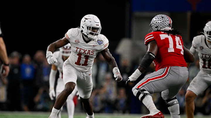 Jan 10, 2025; Arlington, TX, USA; Texas Longhorns linebacker Colin Simmons (11) and Ohio State Buckeyes offensive lineman Donovan Jackson (74) in action during the game between the Texas Longhorns and the Ohio State Buckeyes at AT&T Stadium. Mandatory Credit: Jerome Miron-Imagn Images