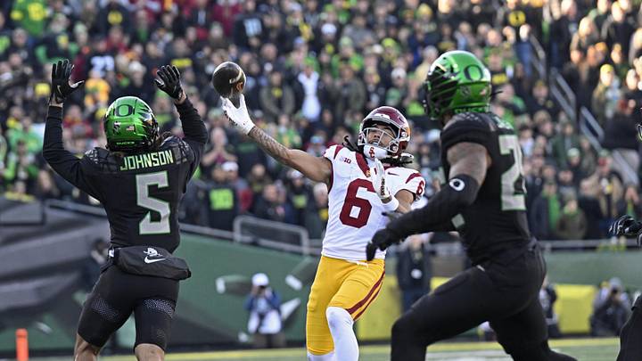 Nov 22, 2025; Eugene, Oregon, USA; Southern California Trojans wide receiver Makai Lemon (6) throws a touch down pass against the Oregon Ducks during the first half at Autzen Stadium. Mandatory Credit: Troy Wayrynen-Imagn Images