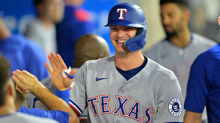 Jul 28, 2025; Anaheim, California, USA;  Texas Rangers third baseman Josh Jung (6) celebrates in the dugout after hitting a solo home run during the fifth inning against the Los Angeles Angels at Angel Stadium. 