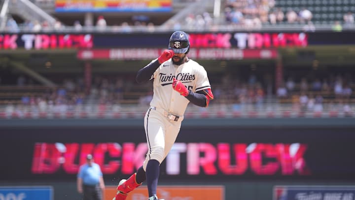 Jun 22, 2025; Minneapolis, Minnesota, USA; Minnesota Twins outfielder Byron Buxton (25) hits a home run against the Milwaukee Brewers in the first inning at Target Field. Mandatory Credit: Brad Rempel-Imagn Images