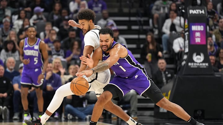 Nov 24, 2024; Sacramento, California, USA; Brooklyn Nets forward Cameron Johnson (left) and Sacramento Kings forward Trey Lyles (41) battle for the ball during the second quarter at Golden 1 Center. Mandatory Credit: Darren Yamashita-Imagn Images Nov 24, 2024; Sacramento, California, USA; Brooklyn Nets forward Cameron Johnson (left) and Sacramento Kings forward Trey Lyles (41) battle for the ball during the second quarter at Golden 1 Center. Mandatory Credit: Darren Yamashita-Imagn Images