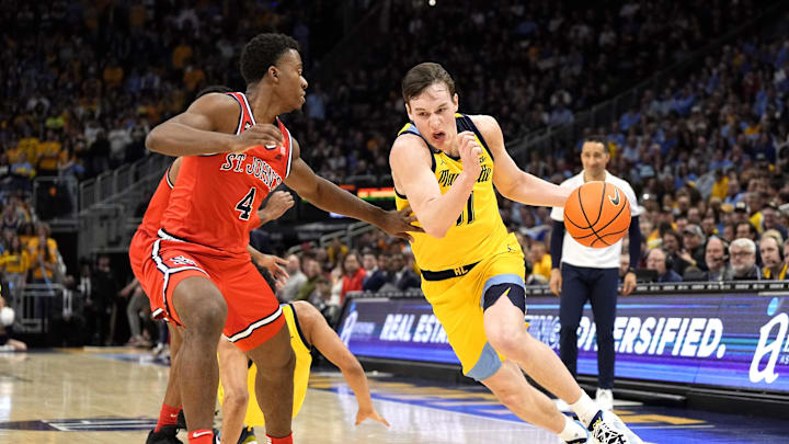 Feb 10, 2024; Milwaukee, Wisconsin, USA;  Marquette Golden Eagles guard Tyler Kolek (11) drives for