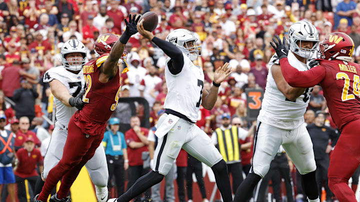 Sep 21, 2025; Landover, Maryland, USA; Las Vegas Raiders quarterback Geno Smith (7) drops back to make a pass during the first half against the Washington Commanders at Northwest Stadium. Mandatory Credit: Amber Searls-Imagn Images