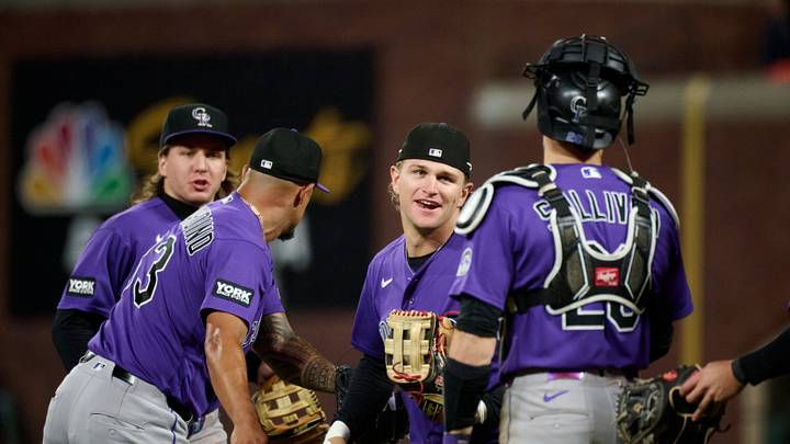 Colorado Rockies outfielder Cole Carrigg (16) celebrates with catcher Brett Sullivan (26) and pitcher Brennan Bernardino (83) Mandatory Credit: Robert Edwards-Imagn Images