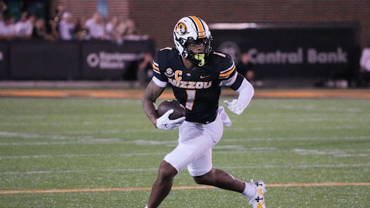 Sep 7, 2024; Columbia, Missouri, USA; Missouri Tigers wide receiver Theo Wease Jr. (1) runs the ball against the Buffalo Bulls during the game at Faurot Field at Memorial Stadium. Mandatory Credit: Denny Medley-Imagn Images