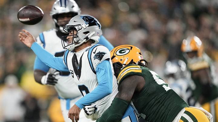 Green Bay Packers defensive end Brenton Cox Jr. (57) pressures Carolina Panthers quarterback Bryce Young Green Bay Packers defensive end Brenton Cox Jr. (57) pressures Carolina Panthers quarterback Bryce Young