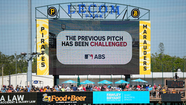 The scoreboard at LECOM Park displays a message about a pitch call being challenged. Major League Baseball is testing an Automated Ball-Stike (ABS) challenge system at select spring training parks. The system allows players to challenge a limited number of ball/stike calls during a game. Calls can be overturned if the pitch tracking technology shows an umpire got a call wrong. The scoreboard at LECOM Park displays a message about a pitch call being challenged. Major League Baseball is testing an Automated Ball-Stike (ABS) challenge system at select spring training parks. The system allows players to challenge a limited number of ball/stike calls during a game. Calls can be overturned if the pitch tracking technology shows an umpire got a call wrong.
