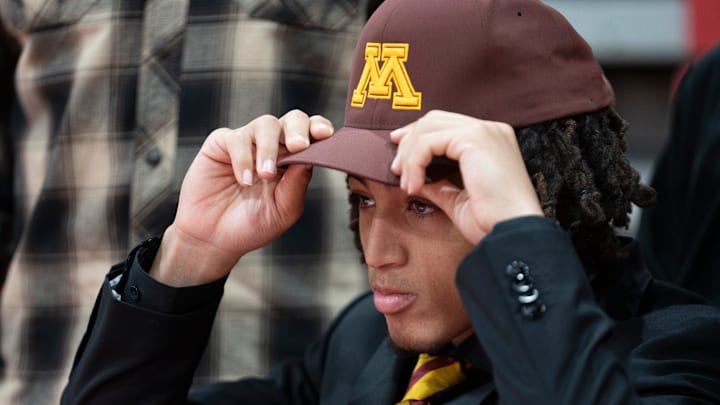 Naiim Parrish, committed to play football for University of Minnesota, puts a hat on his head during a Commitment Day Ceremony for 8 Bergen Catholic athletes at Bergen Catholic High School in Oradell on Wednesday, Dec. 4, 2024. Naiim Parrish, committed to play football for University of Minnesota, puts a hat on his head during a Commitment Day Ceremony for 8 Bergen Catholic athletes at Bergen Catholic High School in Oradell on Wednesday, Dec. 4, 2024.