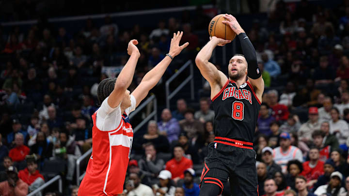 Chicago Bulls guard Zach LaVine (8) takes a jump shot as Washington Wizards forward Kyshawn George (18) defends during the third quarter at Capital One Arena. Mandatory Credit: Reggie Hildred-Imagn Images