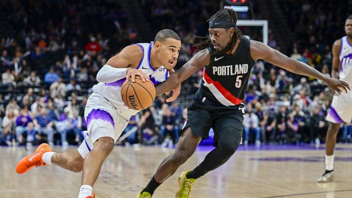 Oct 16, 2025; Salt Lake City, Utah, USA; Utah Jazz guard John Tonje (17) drives with the ball against Portland Trail Blazers guard Jrue Holiday (5) during the second half at Delta Center. Mandatory Credit: Peter Creveling-Imagn Images