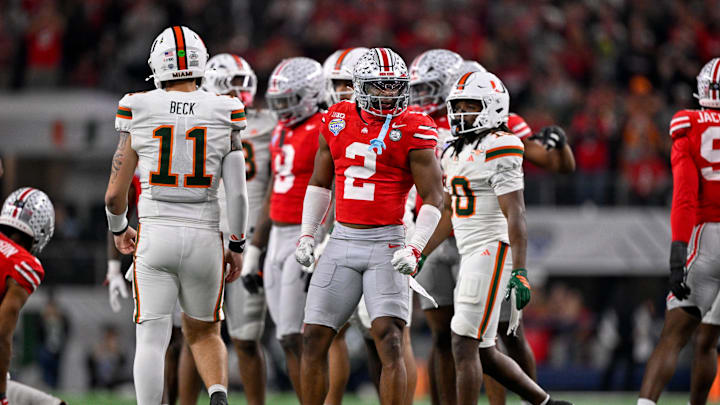 Dec 31, 2025; Arlington, TX, USA; Ohio State Buckeyes safety Caleb Downs (2) celebrates a defensive stop during the 2025 Cotton Bowl and quarterfinal game of the College Football Playoff at AT&T Stadium. Mandatory Credit: Jerome Miron-Imagn Images
