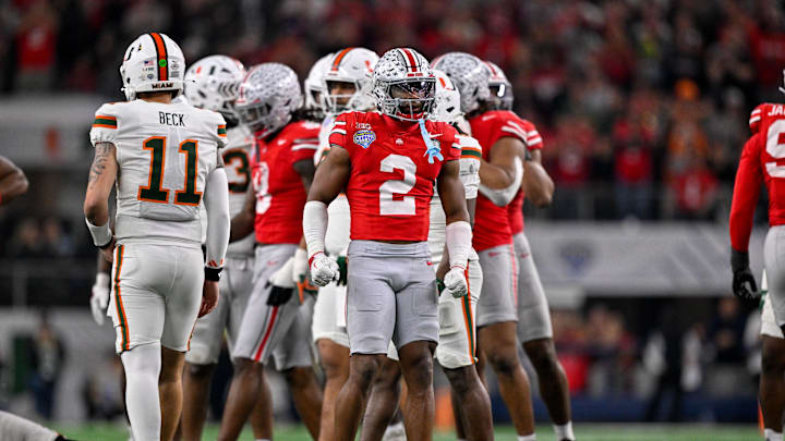 Dec 31, 2025; Arlington, TX, USA; Ohio State Buckeyes safety Caleb Downs (2) celebrates a defensive stop during the 2025 Cotton Bowl and quarterfinal game of the College Football Playoff at AT&T Stadium. Mandatory Credit: Jerome Miron-Imagn Images