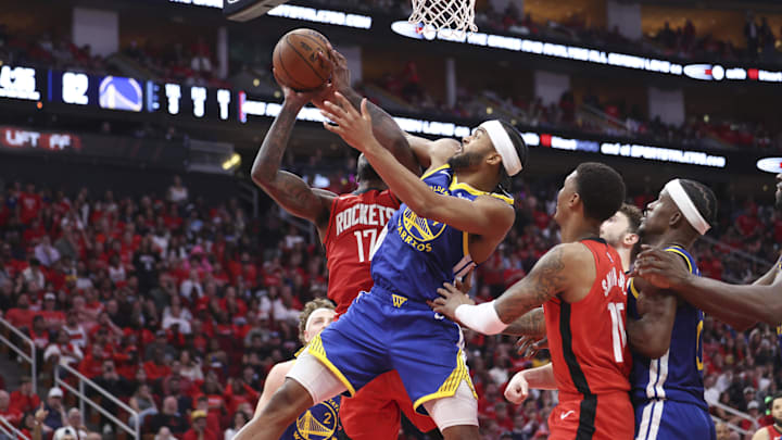 Golden State Warriors guard Moses Moody defends against Houston Rockets forward Tari Eason.