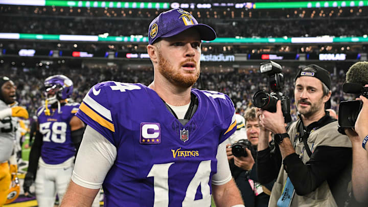Dec 29, 2024; Minneapolis, Minnesota, USA; Minnesota Vikings quarterback Sam Darnold (14) walks off the field after the game against the Green Bay Packers at U.S. Bank Stadium. Mandatory Credit: Jeffrey Becker-Imagn Images