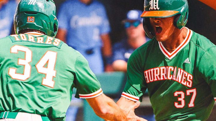 Freshman Michael Torres (34) and Fabio Peralta (37) celebrating after bringing in the winning runs for the Hurricanes against No. 21 North Carolina 