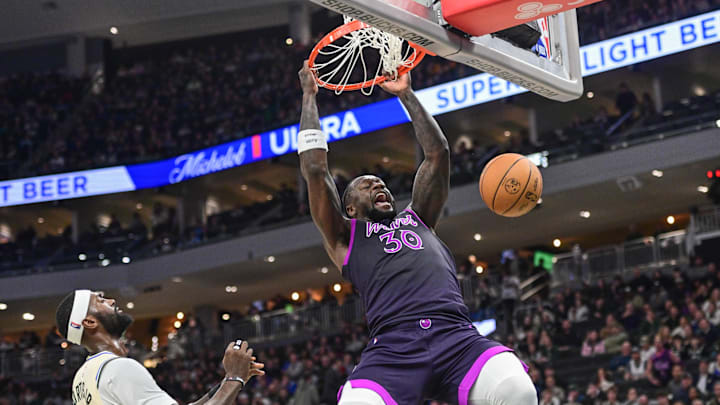 Jan 13, 2026; Milwaukee, Wisconsin, USA; Minnesota Timberwolves forward Julius Randle (30) dunks a basket in the second quarter against Milwaukee Bucks forward Bobby Portis (9) at Fiserv Forum. Mandatory Credit: Benny Sieu-Imagn Images