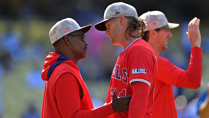 Angels manager Ron Washington (37) congratulates relief pitcher Shaun Anderson (64) after a win against the Los Angeles Dodgers at Dodger Stadium on May 18.