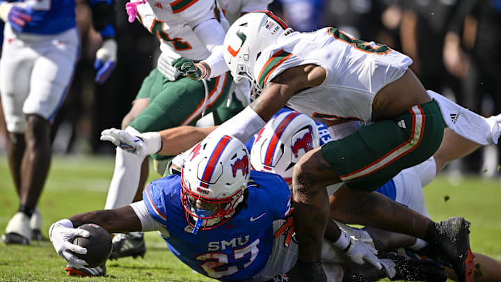 Nov 1, 2025; Dallas, Texas, USA; SMU Mustangs running back T.J. Harden (27) dives for the goal line during the overtime period against the Miami Hurricanes at Gerald J. Ford Stadium. Mandatory Credit: Jerome Miron-Imagn Images Nov 1, 2025; Dallas, Texas, USA; SMU Mustangs running back T.J. Harden (27) dives for the goal line during the overtime period against the Miami Hurricanes at Gerald J. Ford Stadium. Mandatory Credit: Jerome Miron-Imagn Images