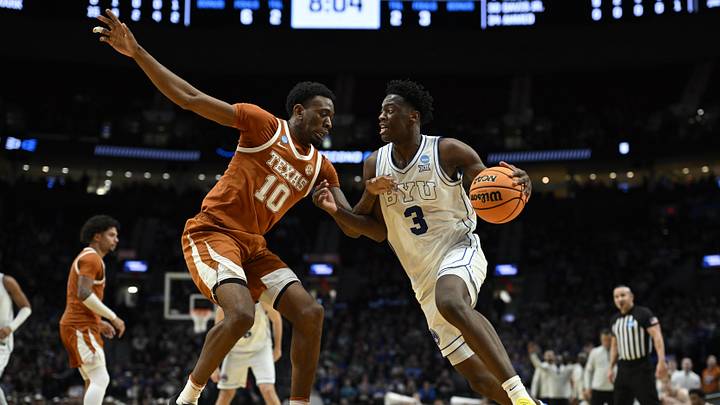 Mar 19, 2026; Portland, OR, USA; BYU Cougars forward AJ Dybantsa (3) drives against Texas Longhorns forward Nic Codie (10) in the second half during a first round game of the men's 2026 NCAA Tournament at Moda Center. Mandatory Credit: Troy Wayrynen-Imagn Images