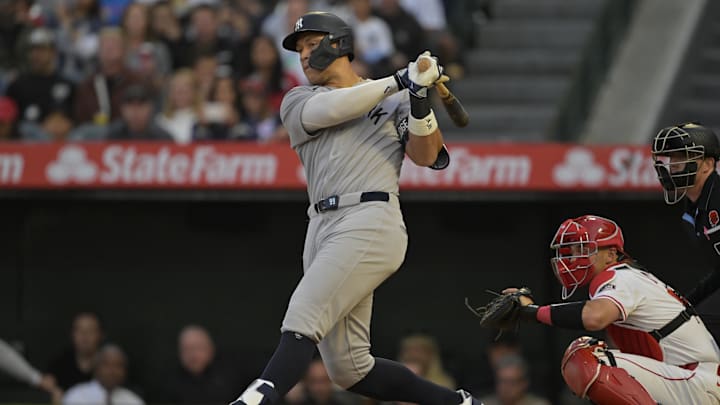 May 26, 2025; Anaheim, California, USA;  New York Yankees right fielder Aaron Judge (99) singles in the fourth inning against the Los Angeles Angels at Angel Stadium. Mandatory Credit: Jayne Kamin-Oncea-Imagn Images