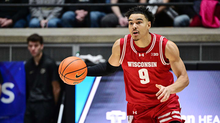 Feb 15, 2025; West Lafayette, Indiana, USA; Wisconsin Badgers guard John Tonje (9) dribbles the ball down the court during the first half against the Purdue Boilermakers at Mackey Arena. Mandatory Credit: Marc Lebryk-Imagn Images