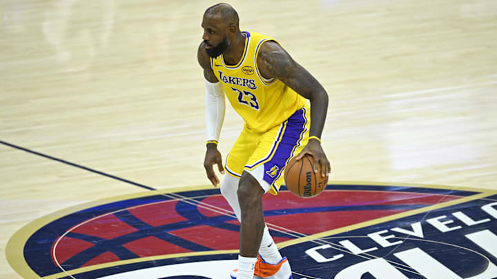 Jan 28, 2026; Cleveland, Ohio, USA; Los Angeles Lakers forward LeBron James (23) brings the ball up court in the fourth quarter against the Cleveland Cavaliers at Rocket Arena. Mandatory Credit: David Richard-Imagn Images