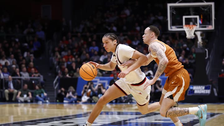Mar 17, 2026; Dayton, OH, USA; NC State Wolfpack guard Matt Able (3) dribbles the ball defended by Texas Longhorns guard Chendall Weaver (2) in the first half during a first four game of the men's 2026 NCAA Tournament at University of Dayton Arena. Mandatory Credit: Rick Osentoski-Imagn Images