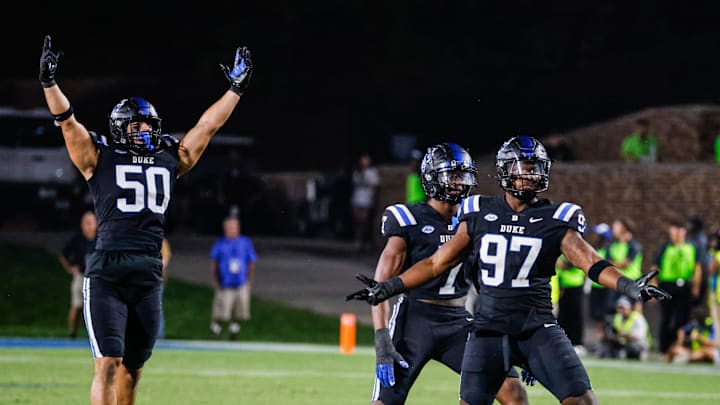 Sep 28, 2024; Durham, North Carolina, USA; Duke Blue Devils defensive end Kevin O'Connor (50) and defensive end Wesley Williams (97) celebrates during the second half of the game against North Carolina Tar Heels at Wallace Wade Stadium.
