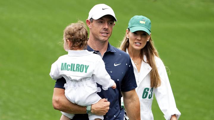 Rory McIlroy holds his daughter Poppy and walks with his wife Erica Stoll. Rory McIlroy holds his daughter Poppy and walks with his wife Erica Stoll.