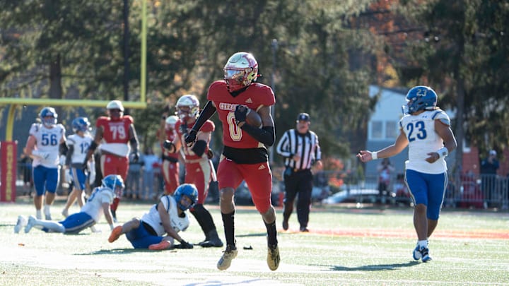 Ohio State-bound Quincy Porter (0) on his way to a touchdown during a 2023 playoff game for Bergen Catholic. On Saturday, he caught two touchdowns in the first half in a home game with Paramus Catholic. 