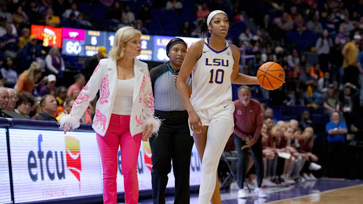 Mulkey talks to Reese mid-play during an LSU basketball game