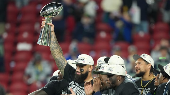 Feb 8, 2026; Santa Clara, CA, USA;  Seattle Seahawks players celebrate with the Vince Lombardi Trophy after defeating the New England Patriots in Super Bowl LX at Levi's Stadium. Mandatory Credit: Kirby Lee-Imagn Images
