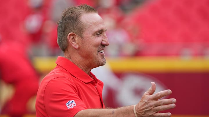 Aug 22, 2024; Kansas City, Missouri, USA; Kansas City Chiefs defensive coordinator Steve Spagnuolo greets a friend on field during warm ups against the Chicago Bears prior to a game at GEHA Field at Arrowhead Stadium.  