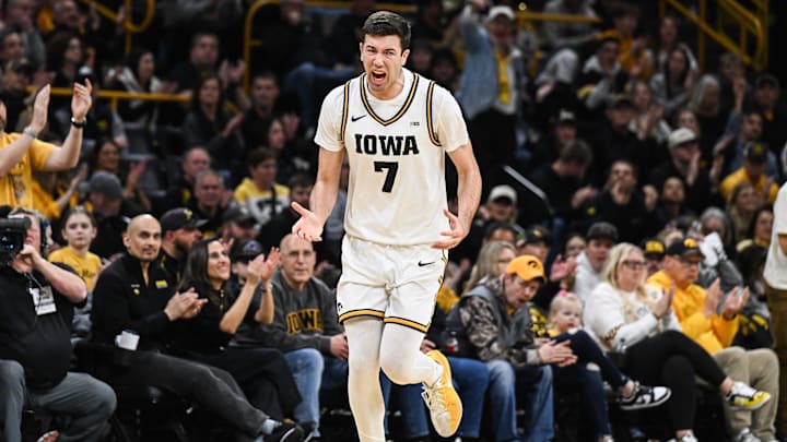 Feb 14, 2026; Iowa City, Iowa, USA; Iowa Hawkeyes forward Alvaro Folgueiras (7) reacts after making a shot against the Purdue Boilermakers during the first half at Carver-Hawkeye Arena. Mandatory Credit: Jeffrey Becker-Imagn Images