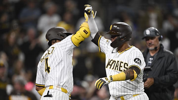 Jun 10, 2025; San Diego, California, USA; San Diego Padres catcher Martin Maldonado (15) is congratulated by Luis Arraez (4) after hitting a solo home run during the sixth inning against the Los Angeles Dodgers at Petco Park. Mandatory Credit: Denis Poroy-Imagn Images
